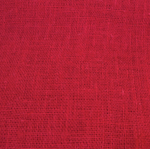 Close up of a red burlap table runner.