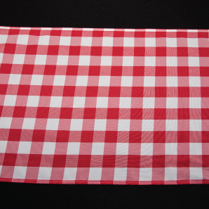Close up of a red gingham check table runner.